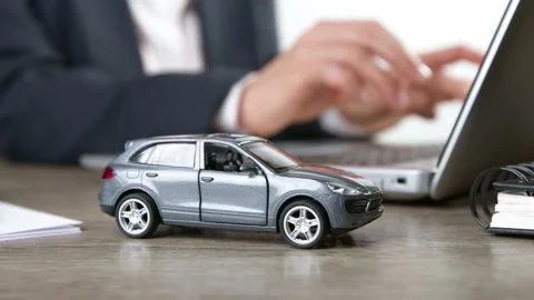 Online car insurance concept using laptop. Renting or buying a car. Stock Footage 258125248