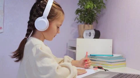 Online classes. Interactive online learning experience. A delightful young girl Stock Footage 253811017