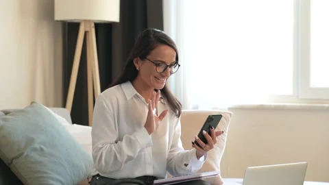 Online consultation with client at videochat with smartphone Video stock 204885010