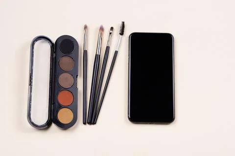 Online course of make up study. Palette of eyeshadows, cosmetics brushes and Photos
