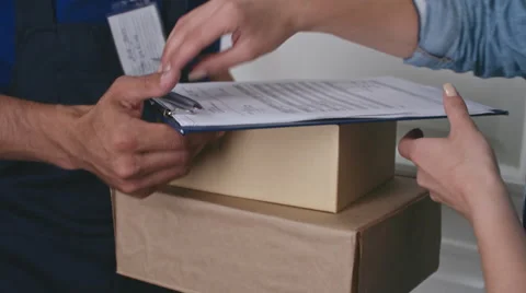 Online Customer Receiving Packages from Delivery Person Stock Footage