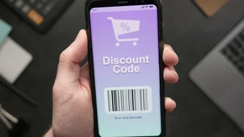 Online Discount Code Voucher On a Mobile Phone Stock Footage 158259481