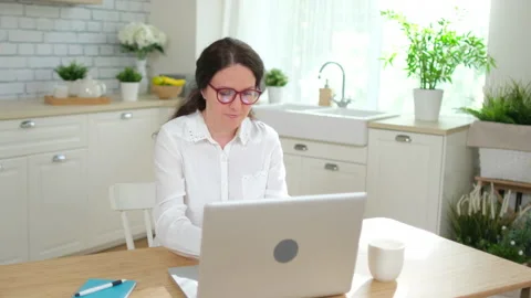 Online distance learning concept. Young woman girl student freelancer Stock Footage 132704274
