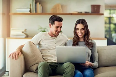 The online experience is even better when its shared. Shot of a happy young Stock Photos