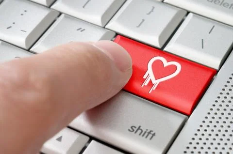Online exploiting heartbleed bug concept with finger on laptop keyboard Stock Photos