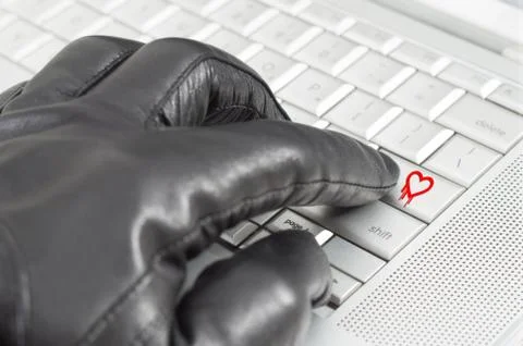 Online exploiting heartbleed bug concept with hand wearing black glove Stock Photos