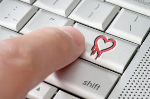 Online exploiting heartbleed bug concept with finger on laptop keyboard Stock Photos