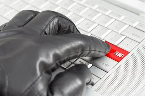 Online exploiting heartbleed bug concept with hand wearing black glove 스톡 사진