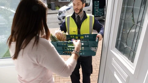 Online Grocery shopping delivery - Supermarket delivers food to a home. Stock Footage
