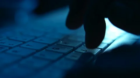 Online Hacker Or Troll Man Typing Late At Night On Laptop Stock Footage 174730135
