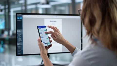 Online Job Application Using Mobile App; Hand Holding Phone; Stock Footage 330585452