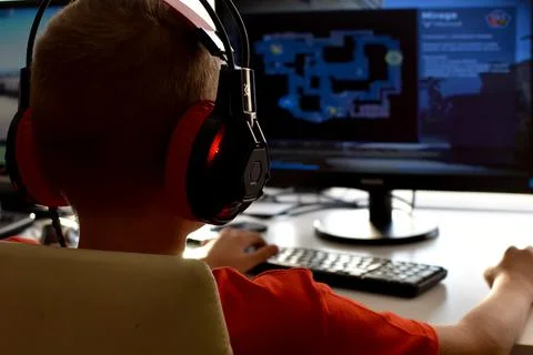 Online learning. boy is playing an online game on  internet. children's gambl Stock Photos