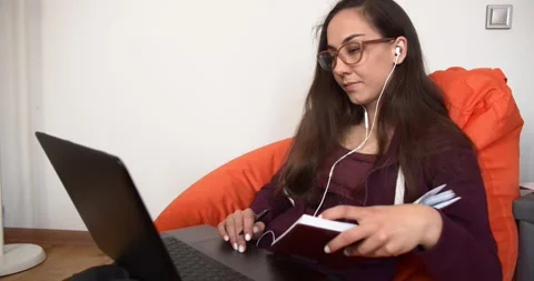 Online learning concept. Girl studying at home on a laptop Stock Footage