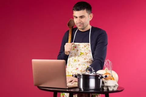 Online learning cooking class concept. Male stream videoblogger cooking and f Stock-Fotos