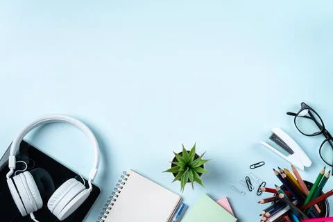 Online learning design concept. Table with tablet, headphone and stationeries Stock Photos