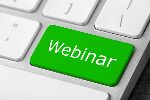 Online learning. Green button with word Webinar on computer keyboard, closeup Foto stock