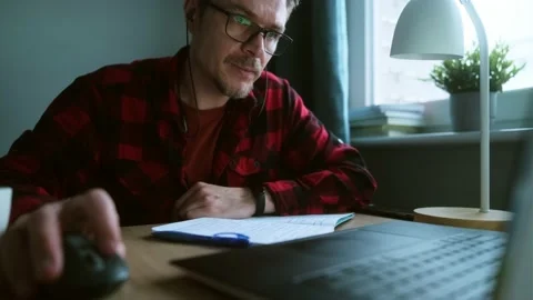 Online learning process. Student studying and take online lesson using laptop Stock Footage 231141567