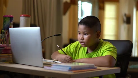 Online learning, technology for school. Children doing homework at home. Stock Footage 156040634