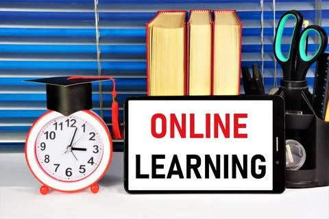 Online learning. The text label on the smartphone screen. Stock Photos