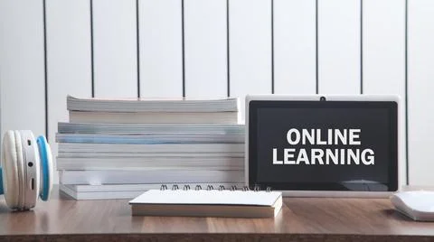 Online Learning text in tablet screen with a business objects. Stock Photos