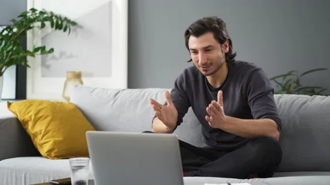 Online learning. Young man talking during video call Stock Footage 149250755