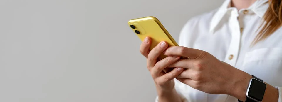 Online messaging. E-commerce and electronic banking. Golden coloured mobile p Stock Photos