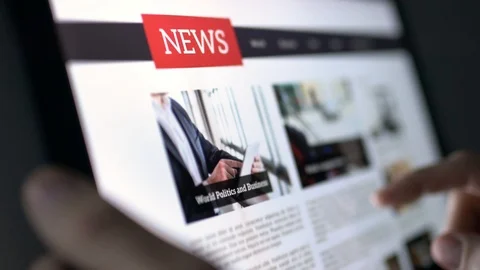 Online news article on tablet screen. Stock Footage
