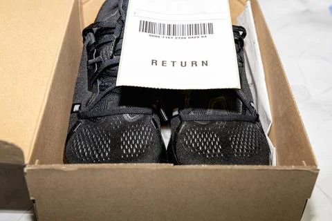 Online order return package with receipt document Stock Photos