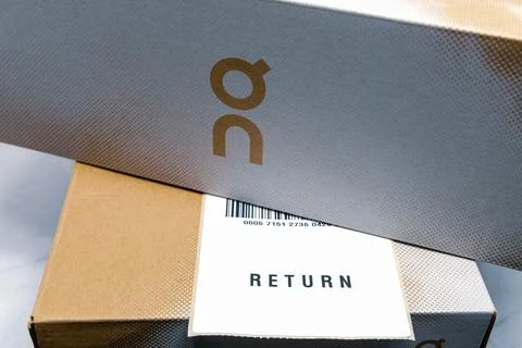 Online order return On package with receipt document. Stock Photos