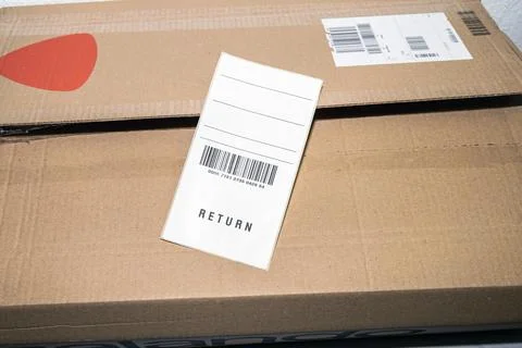 Online order return package with receipt document. Stock Photos