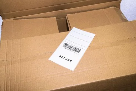 Online order return package with receipt document Stock Photos