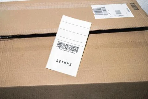 Online order return package with receipt document Stock Photos