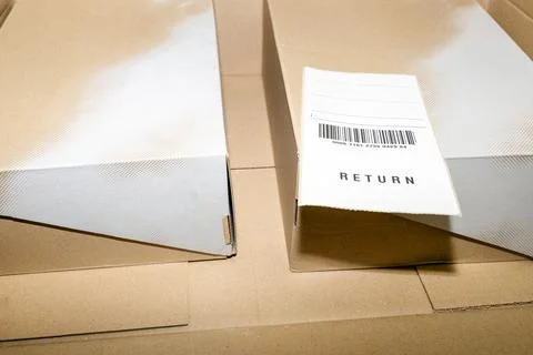 Online order return package with receipt document Stock Photos