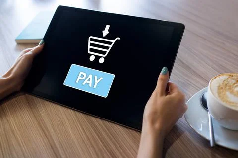Online payment an e-commerce concept. Pay button on tablet screen Stock-Fotos