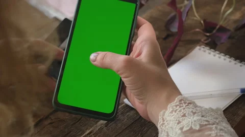 Online payment. Hands scrolling smartphone. Green screen mobile phone mockup. Stock Footage 276544171