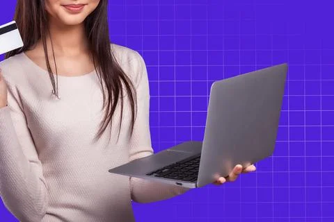 Online payment process with a woman using a laptop and holding a credit card Stock Photos