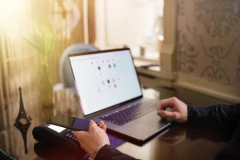 Online payment by using notebook with sun light effect. Stock Photos