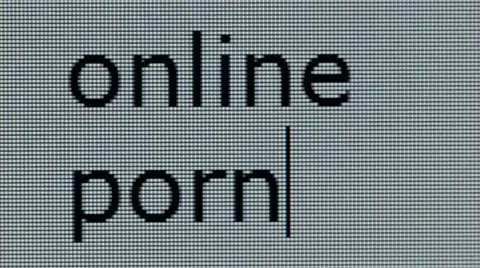 "online porn" being typed on computer screen in close up Stock Footage 54259751