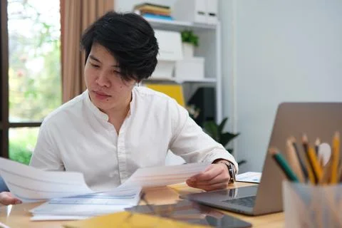 Online professional working analysis data on business tasks or studying Stock Photos