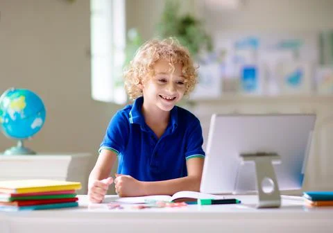 Online remote learning. School kids with computer. Stock Photos