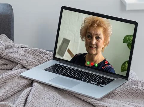 Online remote learning. Teacher with computer having video conference chat with 스톡 사진