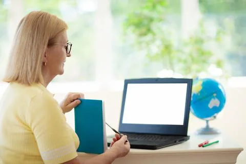 Online remote learning. Teacher with computer. 스톡 사진