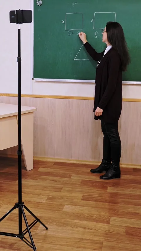 Online schooling, e-learning. Female teacher is holding online lesson, remotely, Stock Footage 318684681