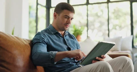 Online, scroll and man with tablet, lounge and copywriting on social media, Stock Footage 329345282
