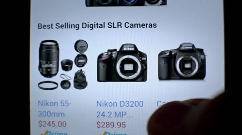 Online shop website on touchscreen display Buy sell new modern dslr photo camera Stock Footage 56159150