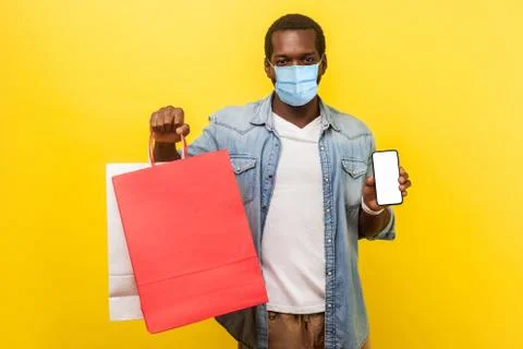 Online shopping and delivery on quarantine. Portrait of young man with medica Stock Photos