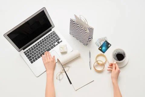 Online shopping and e-commerce with a person using a laptop, credit card, and Stock Photos