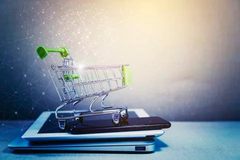 Online shopping background. E-commerce marketing technology, shopping cart on Stock Photos