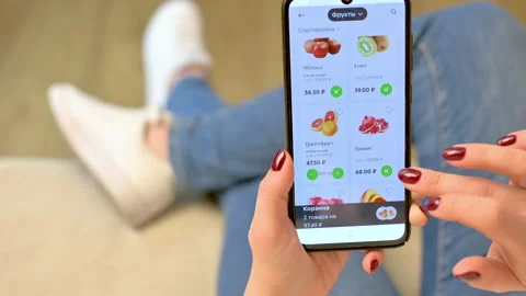 Online shopping, Buying from home, Online store. Woman chooses a product Stock Footage 149165853