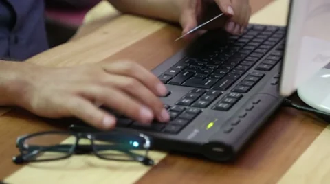 Online shopping with computer on wood table Stock Footage 67886129